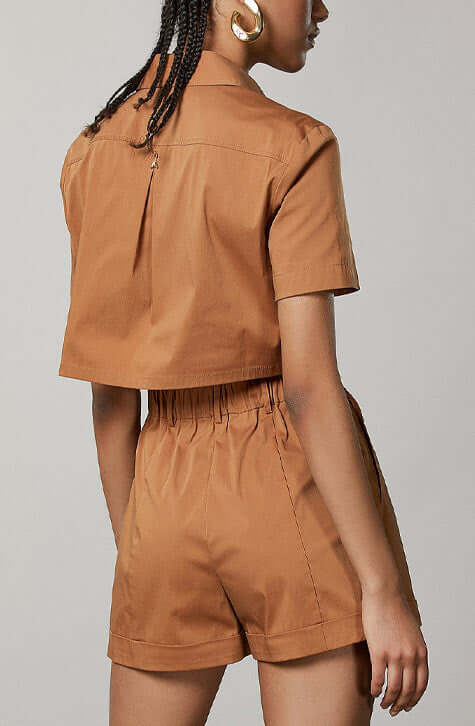 Cotton Stretch mini playsuit. Fly detail in the back.  Eban Brown