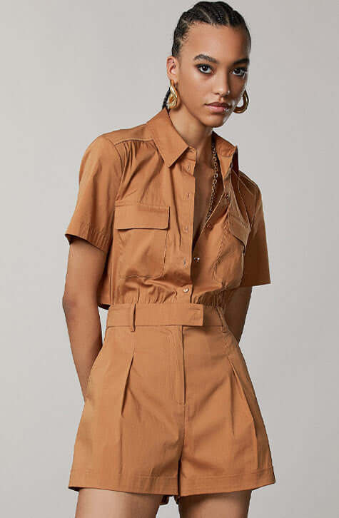 Cotton Stretch mini playsuit. Fly detail in the back.  Eban Brown