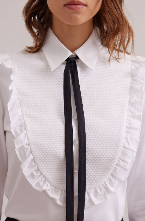 The MANUSCRIT is the perfect white shirt to complete your look. Featuring a large textured bib detail that is framed with a single ruffle. The classic collar, button placket and French cuffs that allow for cufflinks are cotton voile