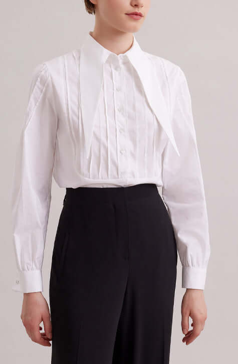 The ALFRED is a modern shirt with a contemporary fit, made from lightweight poplin. The point collar is extended and long, with a French cuff that allows for cufflinks. Pintucks on the shoulders and front bib create a feminine touch. Princess darts on the back provide a flattering shape. Wear this as part of your work wardrobe or as everyday casual wear.