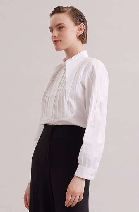 The ALFRED is a modern shirt with a contemporary fit, made from lightweight poplin. The point collar is extended and long, with a French cuff that allows for cufflinks. Pintucks on the shoulders and front bib create a feminine touch. Princess darts on the back provide a flattering shape. Wear this as part of your work wardrobe or as everyday casual wear.