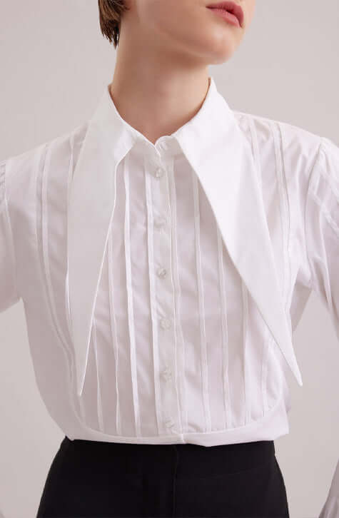 The ALFRED is a modern shirt with a contemporary fit, made from lightweight poplin. The point collar is extended and long, with a French cuff that allows for cufflinks. Pintucks on the shoulders and front bib create a feminine touch. Princess darts on the back provide a flattering shape. Wear this as part of your work wardrobe or as everyday casual wear.