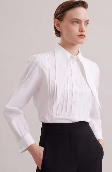 The ALFRED is a modern shirt with a contemporary fit, made from lightweight poplin. The point collar is extended and long, with a French cuff that allows for cufflinks. Pintucks on the shoulders and front bib create a feminine touch. Princess darts on the back provide a flattering shape. Wear this as part of your work wardrobe or as everyday casual wear.