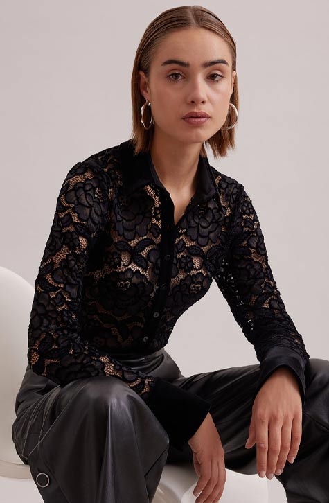 The SALINGER is a sheer black net shirt embroidered with lace floral patterns outlined in velvet. This luxurious piece features a point collar, center button placket and French cuffs that allows for cufflinks, all in black velvet. 