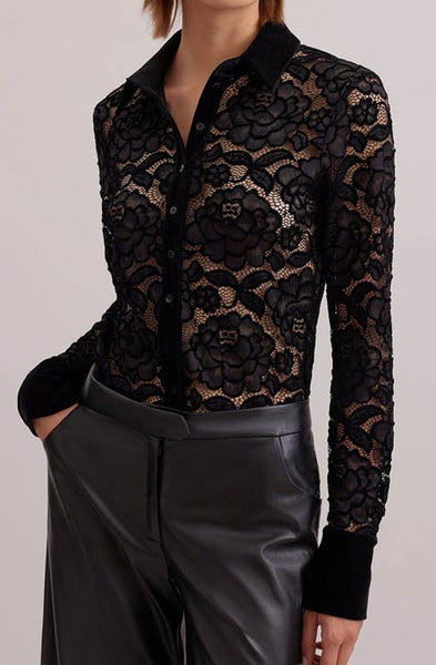 The SALINGER is a sheer black net shirt embroidered with lace floral patterns outlined in velvet. This luxurious piece features a point collar, center button placket and French cuffs that allows for cufflinks, all in black velvet. 