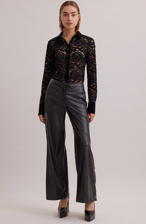 The SALINGER is a sheer black net shirt embroidered with lace floral patterns outlined in velvet. This luxurious piece features a point collar, center button placket and French cuffs that allows for cufflinks, all in black velvet. 