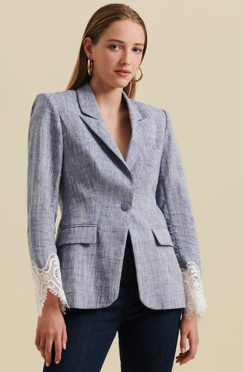 The VATXI is a long sleeve tailored linen jacket enhanced with openwork lace at the wrists. Designed with coordinating peak lapels and lightly padded shoulders, the VATXI jacket is completed with flattering darting to ensure a fitted silhouette.