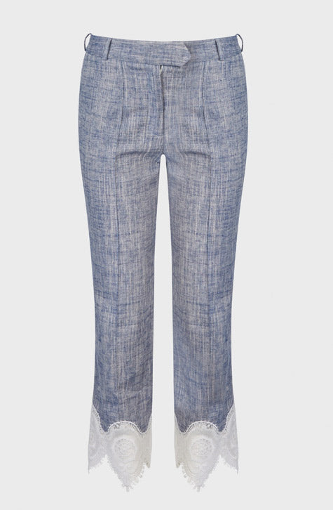 The VINCE is a tailored linen pant enhanced with transparent embroidered lace found along the bottom of the leg. The VINCE is enhanced with a cropped hem and fixed pleating placed along the front center of the pant leg ensuring a seamless silhouette.
