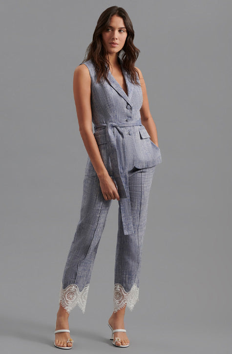 The VINCE is a tailored linen pant enhanced with transparent embroidered lace found along the bottom of the leg. The VINCE is enhanced with a cropped hem and fixed pleating placed along the front center of the pant leg ensuring a seamless silhouette.