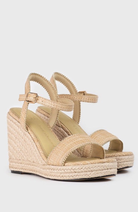 The ONECA sandal is a wedge platform and heel in jute, enhanced with a delicate flower detail along the toe straps. An ankle strap completes the look of this ultra-chic sandal. 