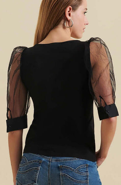 The AERIAL is a  pima cotton top enhanced with voluminous sleeves crafted from a sheer mesh fabric and featuring an elegant V-neckline. The AERIAL is both refined and understated making it a perfect addition to your wardrobe to wear to the office and for evening events.