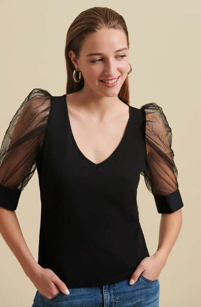 The AERIAL is a  pima cotton top enhanced with voluminous sleeves crafted from a sheer mesh fabric and featuring an elegant V-neckline. The AERIAL is both refined and understated making it a perfect addition to your wardrobe to wear to the office and for evening events.