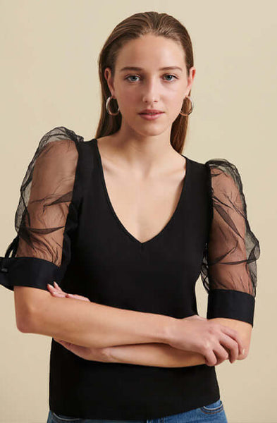 The AERIAL is a  pima cotton top enhanced with voluminous sleeves crafted from a sheer mesh fabric and featuring an elegant V-neckline. The AERIAL is both refined and understated making it a perfect addition to your wardrobe to wear to the office and for evening events.